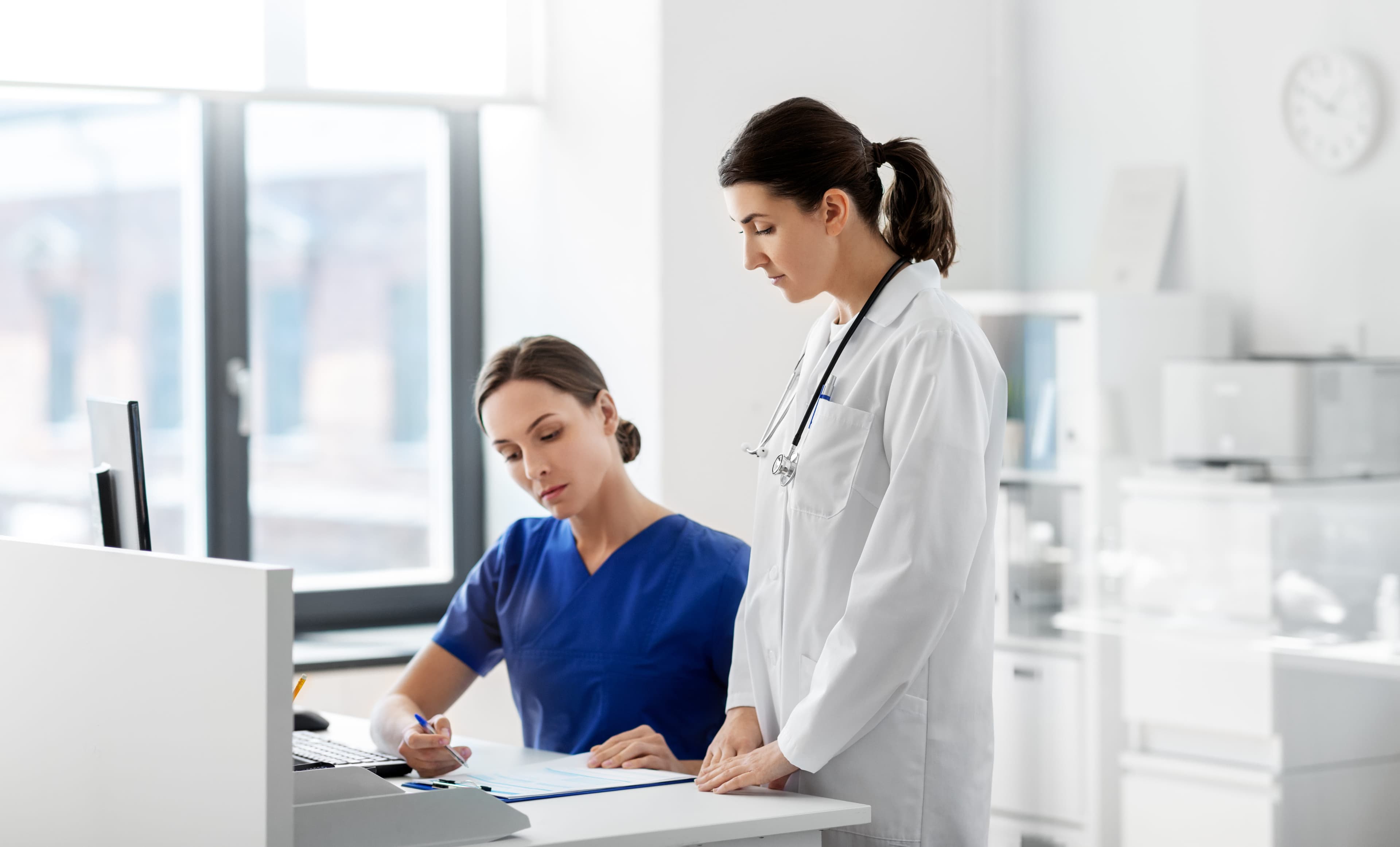 Medical professional reviewing patient care